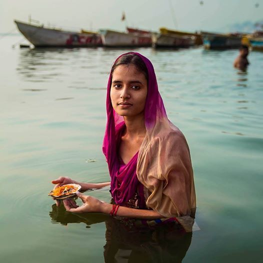 Indian Girl Worshiping in river Ganga